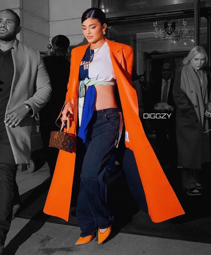 Kylie-Jenner-dazzles-in-an-orange-leather-jacket-for-sale.webp